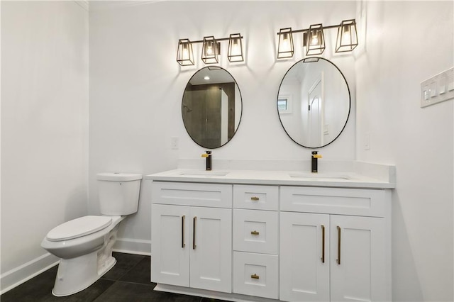 bathroom featuring tile patterned floors, vanity, and toilet