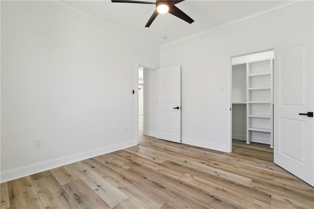 unfurnished bedroom featuring ceiling fan, light hardwood / wood-style floors, and crown molding