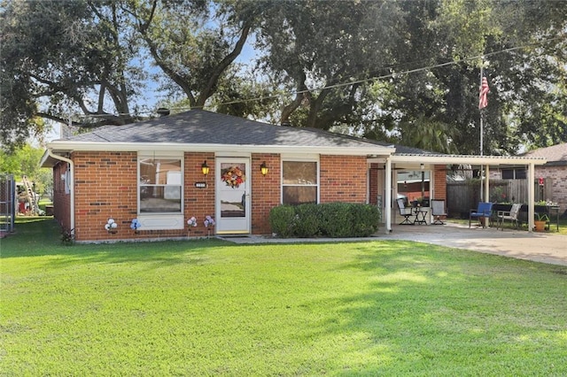 single story home with a patio area and a front lawn