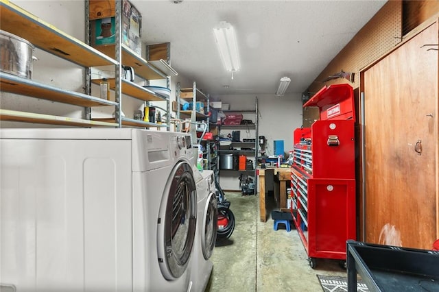 storage area with washing machine and clothes dryer