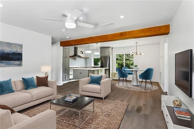 living room with beamed ceiling, ceiling fan with notable chandelier, and dark hardwood / wood-style flooring