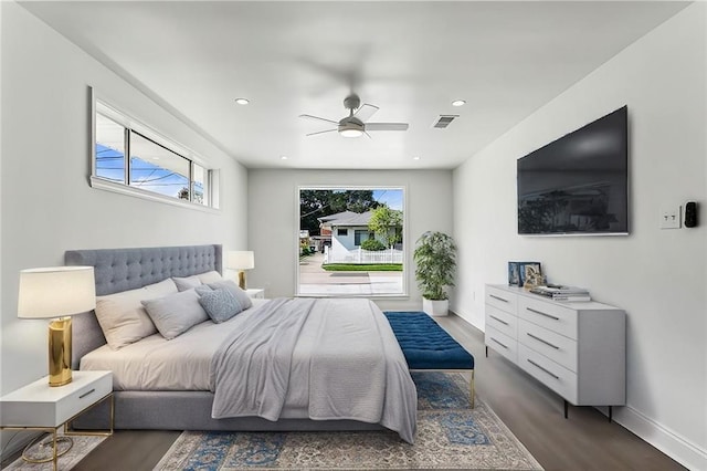 bedroom featuring ceiling fan and dark hardwood / wood-style flooring