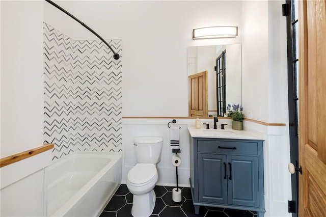 full bathroom featuring vanity, washtub / shower combination, toilet, and tile patterned flooring