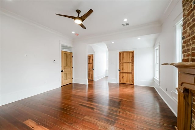 unfurnished living room featuring crown molding, dark hardwood / wood-style floors, and ceiling fan