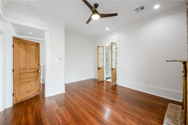 unfurnished living room with dark wood-type flooring, ceiling fan, and ornamental molding