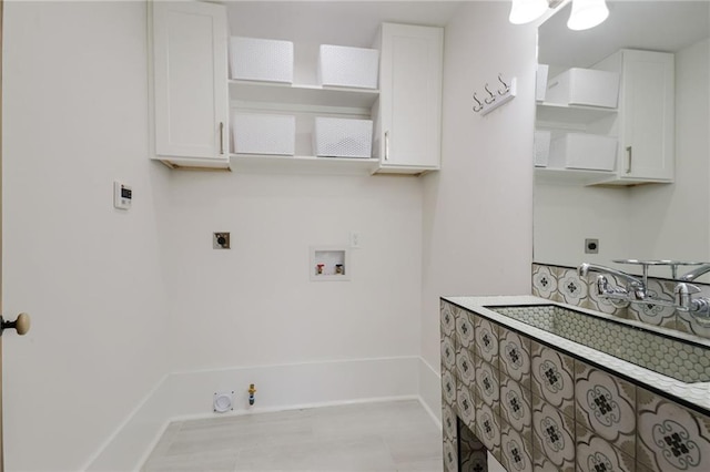 laundry area with gas dryer hookup, sink, washer hookup, and electric dryer hookup