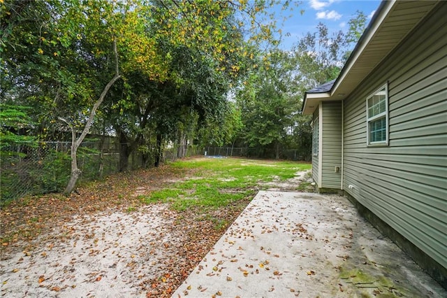 view of yard with a fenced backyard and a patio area