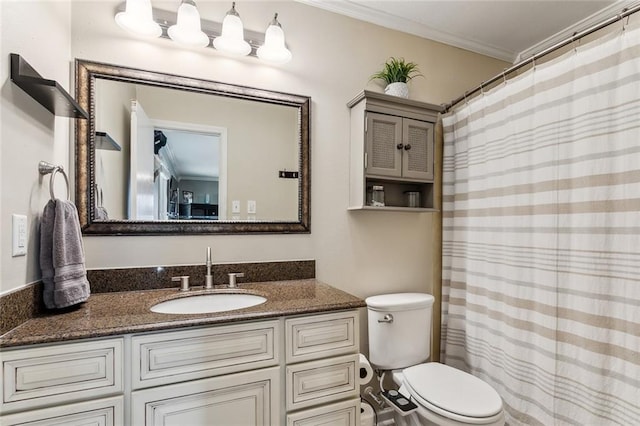 full bath featuring vanity, toilet, and crown molding