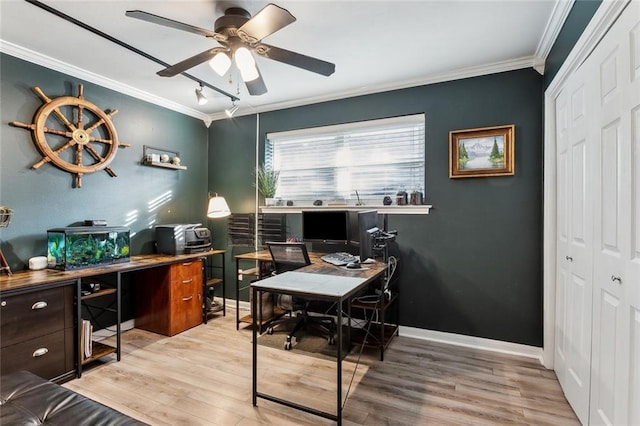 office space featuring crown molding, baseboards, wood finished floors, and a ceiling fan