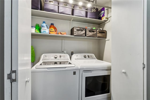 laundry area with laundry area and independent washer and dryer