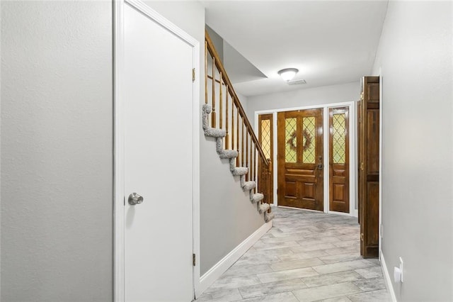 entrance foyer with light wood-type flooring