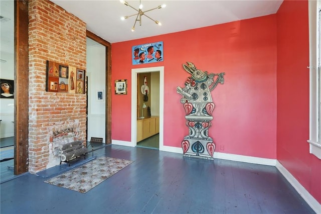 unfurnished living room with a notable chandelier and dark hardwood / wood-style flooring