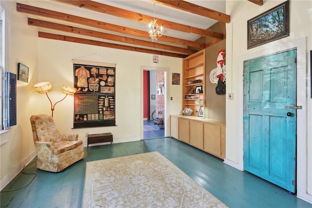 interior space featuring beamed ceiling, dark wood-type flooring, and an inviting chandelier