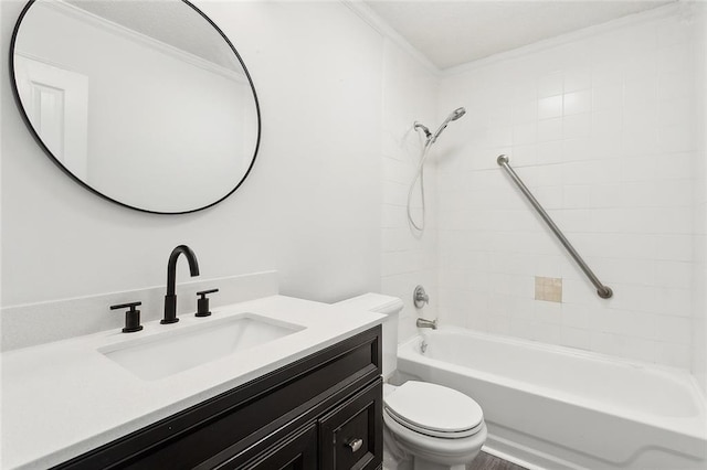 full bathroom with toilet, tiled shower / bath, ornamental molding, and vanity