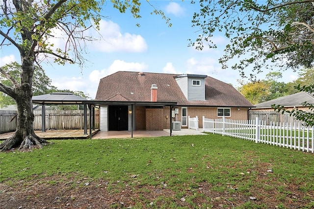 back of house featuring a gazebo, a yard, cooling unit, and a patio area