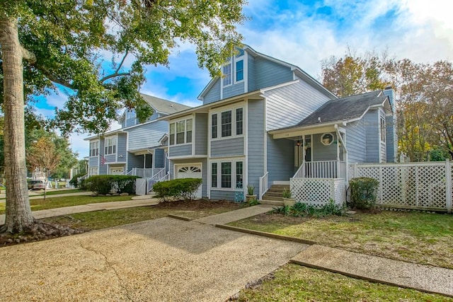 view of front facade with a porch and a garage