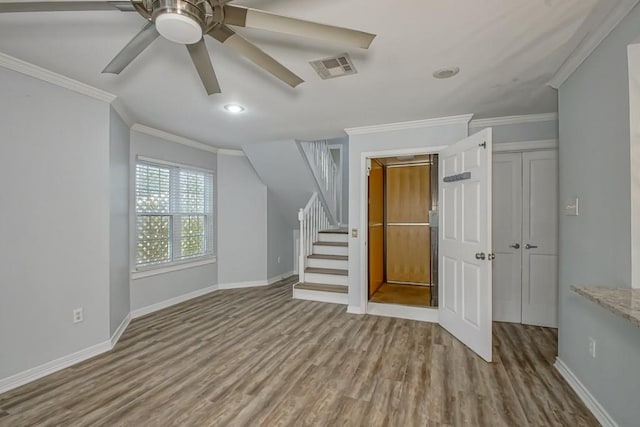 additional living space featuring light hardwood / wood-style flooring and ceiling fan