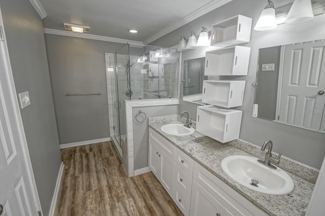 bathroom featuring crown molding, vanity, hardwood / wood-style flooring, and walk in shower