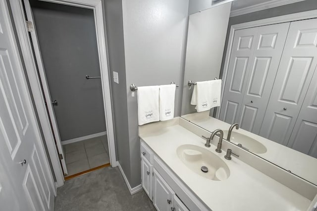 bathroom featuring tile patterned floors, vanity, and ornamental molding