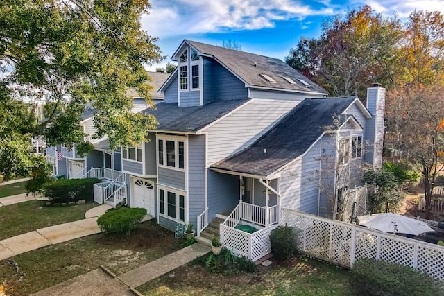 front facade featuring a porch and a garage