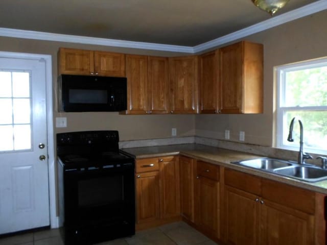 kitchen featuring light tile patterned flooring, black appliances, sink, and ornamental molding