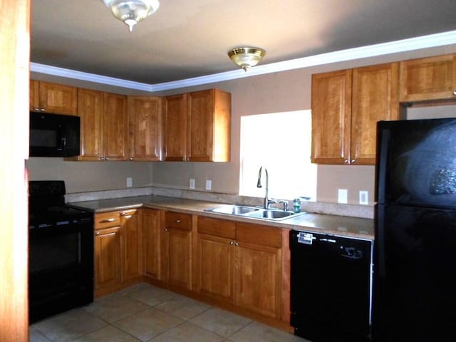 kitchen featuring crown molding, black appliances, sink, and light tile patterned floors