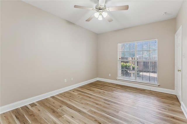 spare room with light hardwood / wood-style flooring and ceiling fan