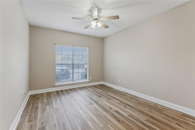 empty room with light wood-type flooring and ceiling fan