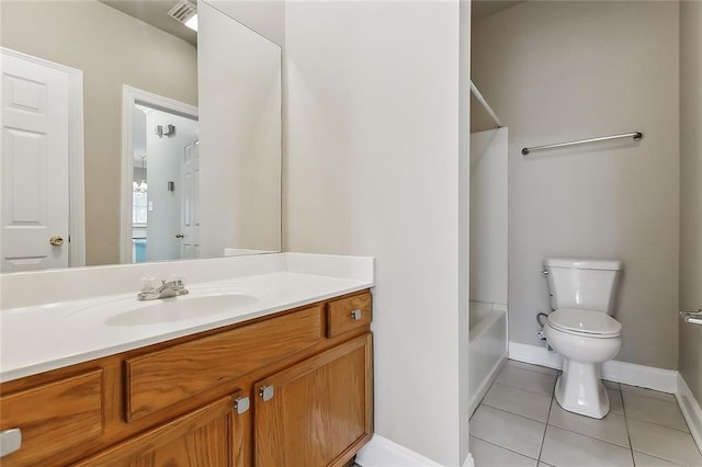 bathroom featuring vanity, toilet, and tile patterned floors