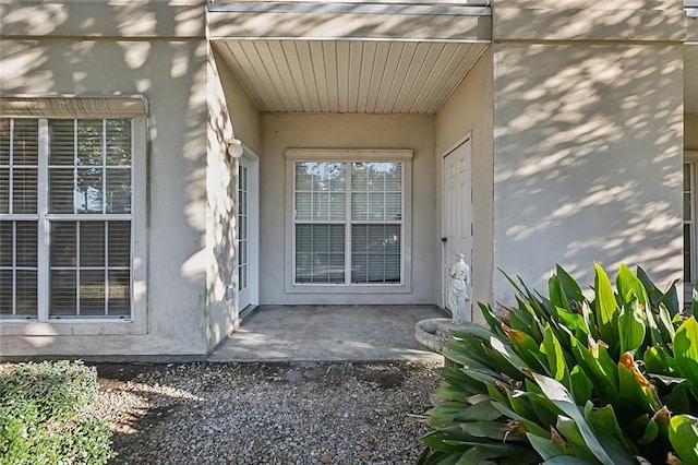 doorway to property featuring a patio area