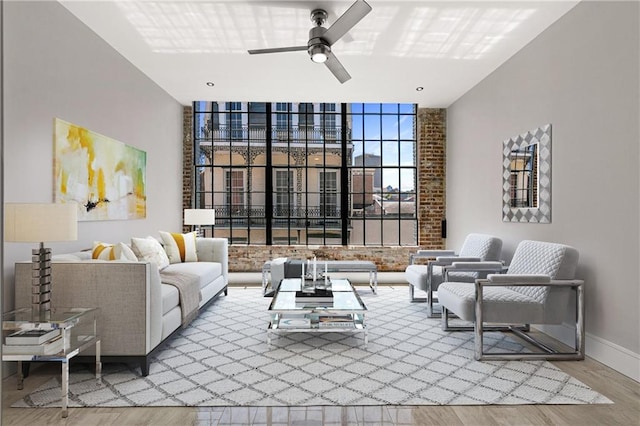 living room with hardwood / wood-style floors and ceiling fan