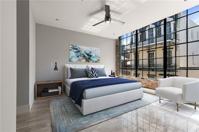 917 Conti St Unit 205, New Orleans, LA 70112 - bedroom with baseboards, a ceiling fan, and wood finished floors