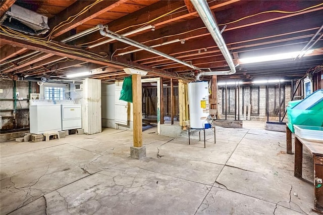 basement featuring washer and dryer and gas water heater