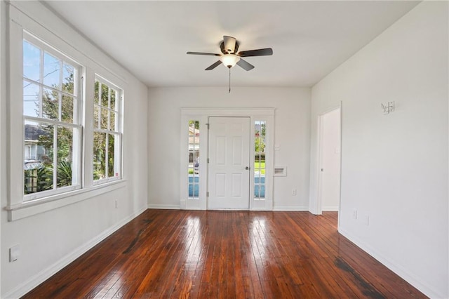 entryway with dark wood-type flooring and ceiling fan