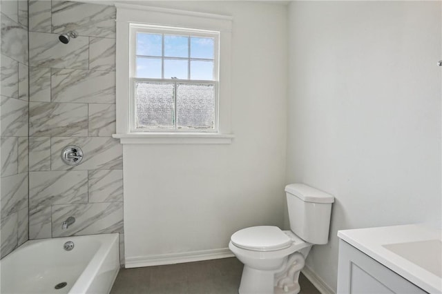 full bathroom featuring vanity, toilet, and tiled shower / bath