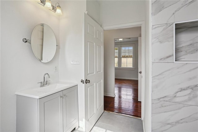 bathroom with vanity and hardwood / wood-style floors