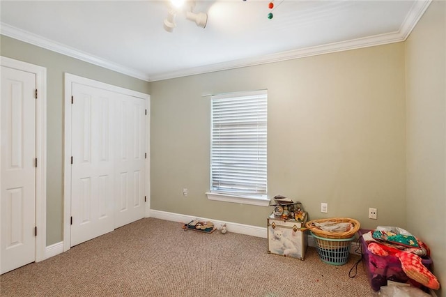 playroom featuring light carpet, ornamental molding, and baseboards