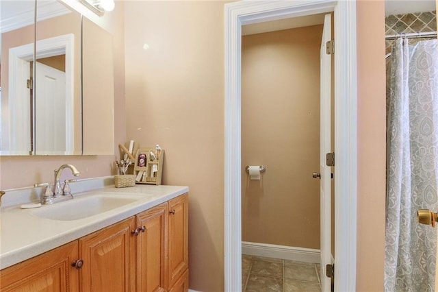 full bath with a shower with shower curtain, vanity, baseboards, and tile patterned floors