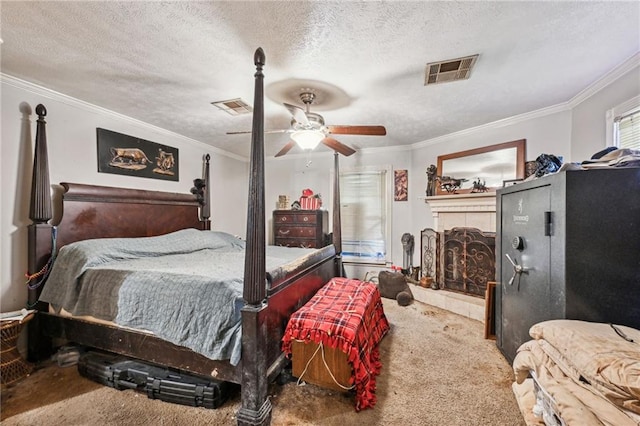 carpeted bedroom with ceiling fan, crown molding, and a textured ceiling