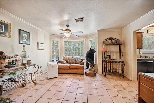 living room with ceiling fan, crown molding, a textured ceiling, and light tile patterned floors