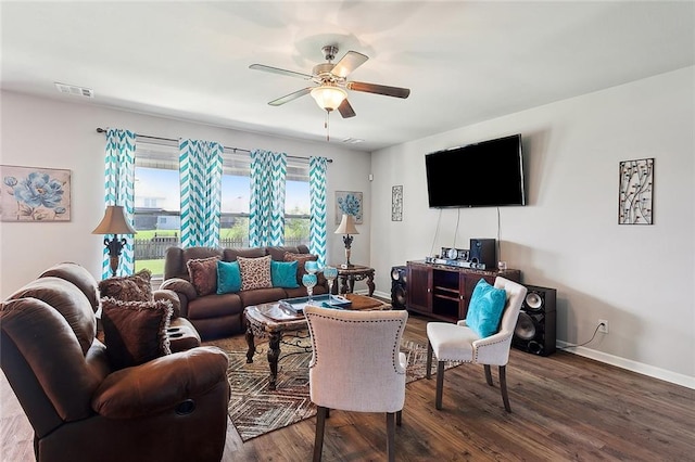 living room featuring wood-type flooring and ceiling fan