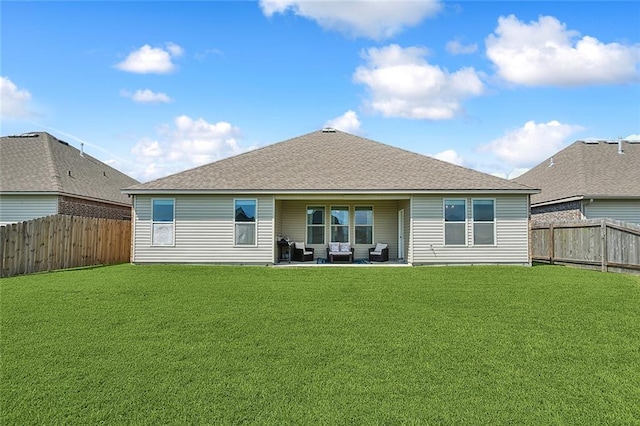 back of property featuring a patio area and a lawn