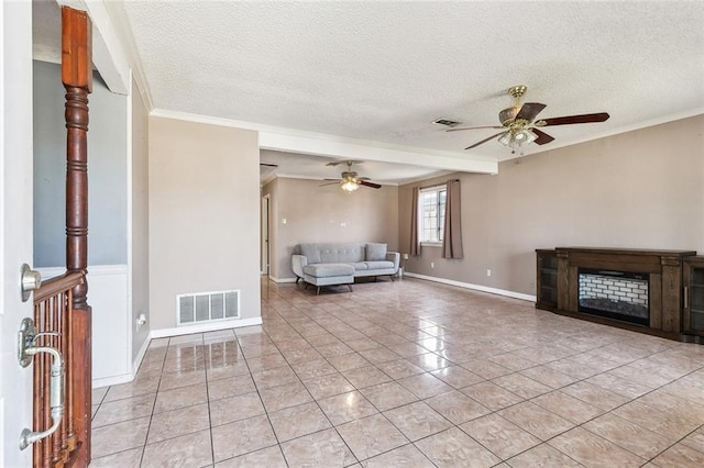 unfurnished living room with a textured ceiling, light tile patterned flooring, and crown molding