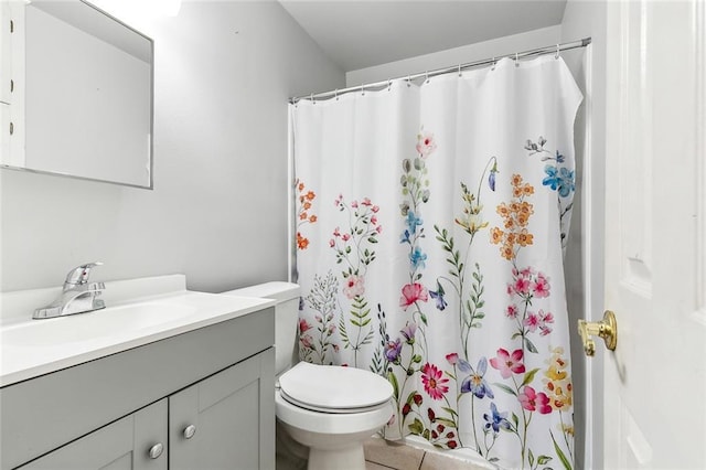 bathroom featuring tile patterned floors, vanity, toilet, and a shower with curtain