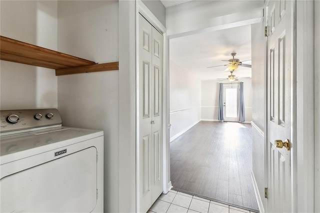 laundry area featuring ceiling fan, light wood-type flooring, and washer / clothes dryer