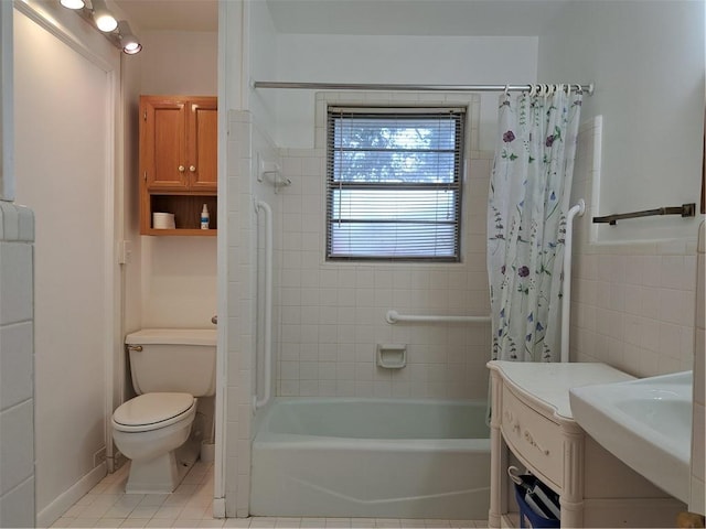 bathroom featuring toilet, tile patterned floors, and shower / tub combo with curtain