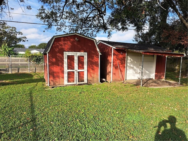 view of outbuilding featuring a yard