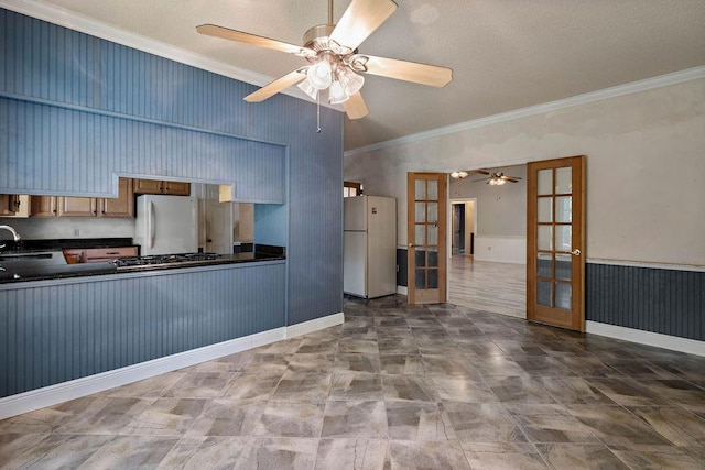 kitchen featuring white refrigerator, refrigerator, french doors, and crown molding