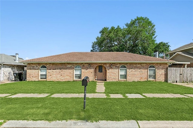 ranch-style house with a front lawn