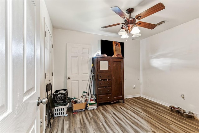 miscellaneous room with ceiling fan and hardwood / wood-style floors